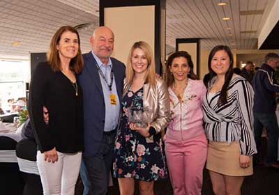 The Thoroughbred Aftercare Alliance accepts the Award of Merit at the 2019 Alibi Breakfast during Preakness week. (Jim McCue/Maryland Jockey Club)