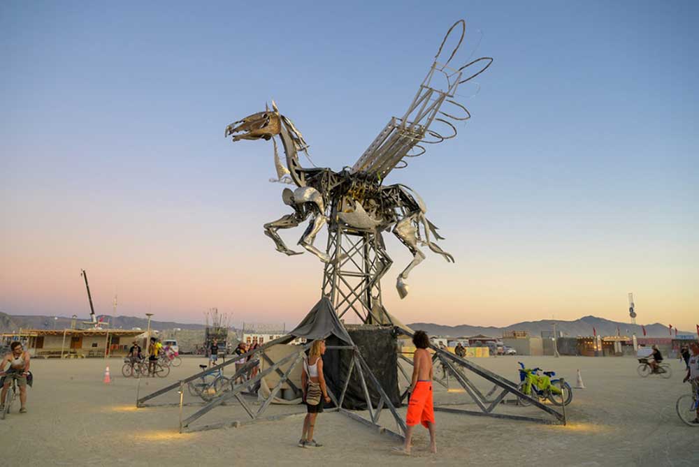 In order to see Nebula Rider run, fly and flame all at the same time – for a timed one-minute period – Burning Man attendees had to work together, simultaneously pressing eight buttons that were situated around the base | Adrian Landon