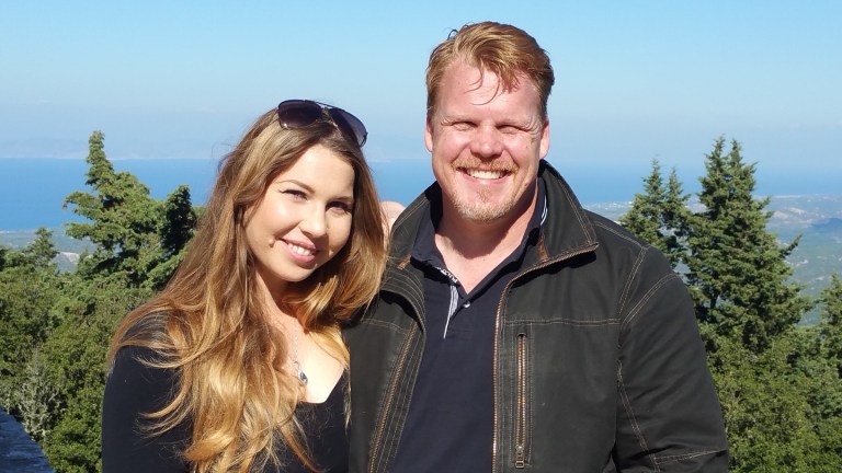 Natalie Orfanidi and Michael Dale, co-founders of Epos Custom Leather, enjoy the scenic vistas on a mountainside in Rhodes, the fourth largest island in Greece.