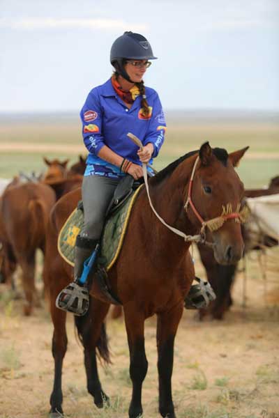 Heather Wallace prepares to ride in the Officials Race. © Gobi Desert Cup
