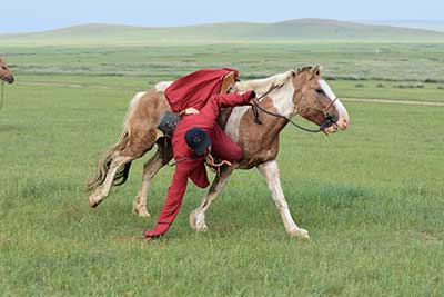 A local herdsmen shows off his horsemanship for the riders and for the camera! © Gobi Desert Cup