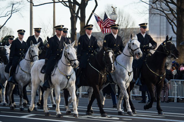 U.S. Army Soldiers, members of the Caisson platoon of the 3d United States Infantry "The Old Guard", ride their horses during the Presidential Inauguration Parade in Washington, D.C