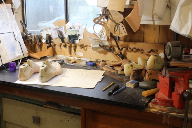 Charlie Dunn’s work bench, where Lee Miller works boot magic today at Texas Traditions in Austin.