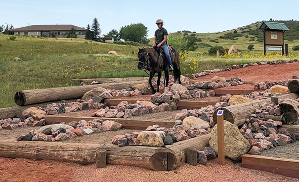 By training horses to overcome obstacles, the course makes trail riding safer. Photo Courtesy of Equestrian Skills Course.