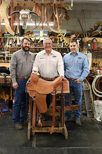 Richard Oliver, center, is 3rd generation of owner of Oliver Saddle Shop, a multi-generational, century old business in Amarillo, Texas.  His sons Zeb, left, and Bryan, right, work alongside their father.