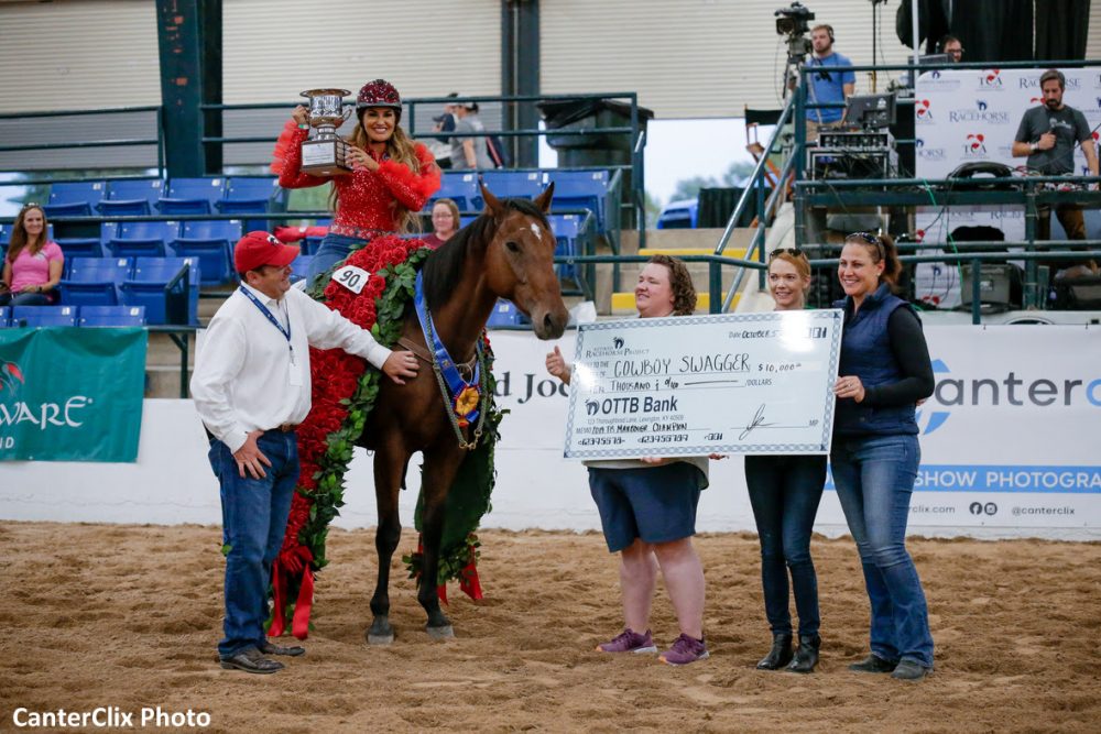 2019 Thoroughbred Makeover Champion, Cowboy Swagger trained by Fallon Taylor, with (L-R) Mike McMahon, President of Thoroughbred Charities of America; Kirsten Green, Managing Director of the Retired Racehorse Project; Erin Crady, Executive Director of Thoroughbred Charities of America; and Jen Rotz, Executive Director of the Retired Racehorse Project.