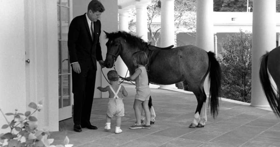 President John F. Kennedy with John Jr., Caroline and "Macaroni". (Robert Knudsen, White House / John Fitzgerald Kennedy Library)